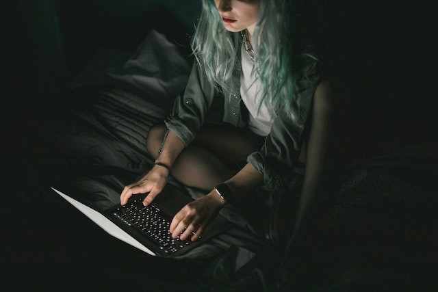 Night Time Girl on Laptop Dark Theme